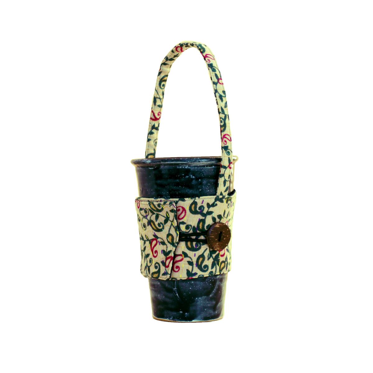 https://www.bashaboutique.com/wp-content/uploads/2023/01/Kantha-Reusable-Cup-Sleeve-with-Handle-1.jpg