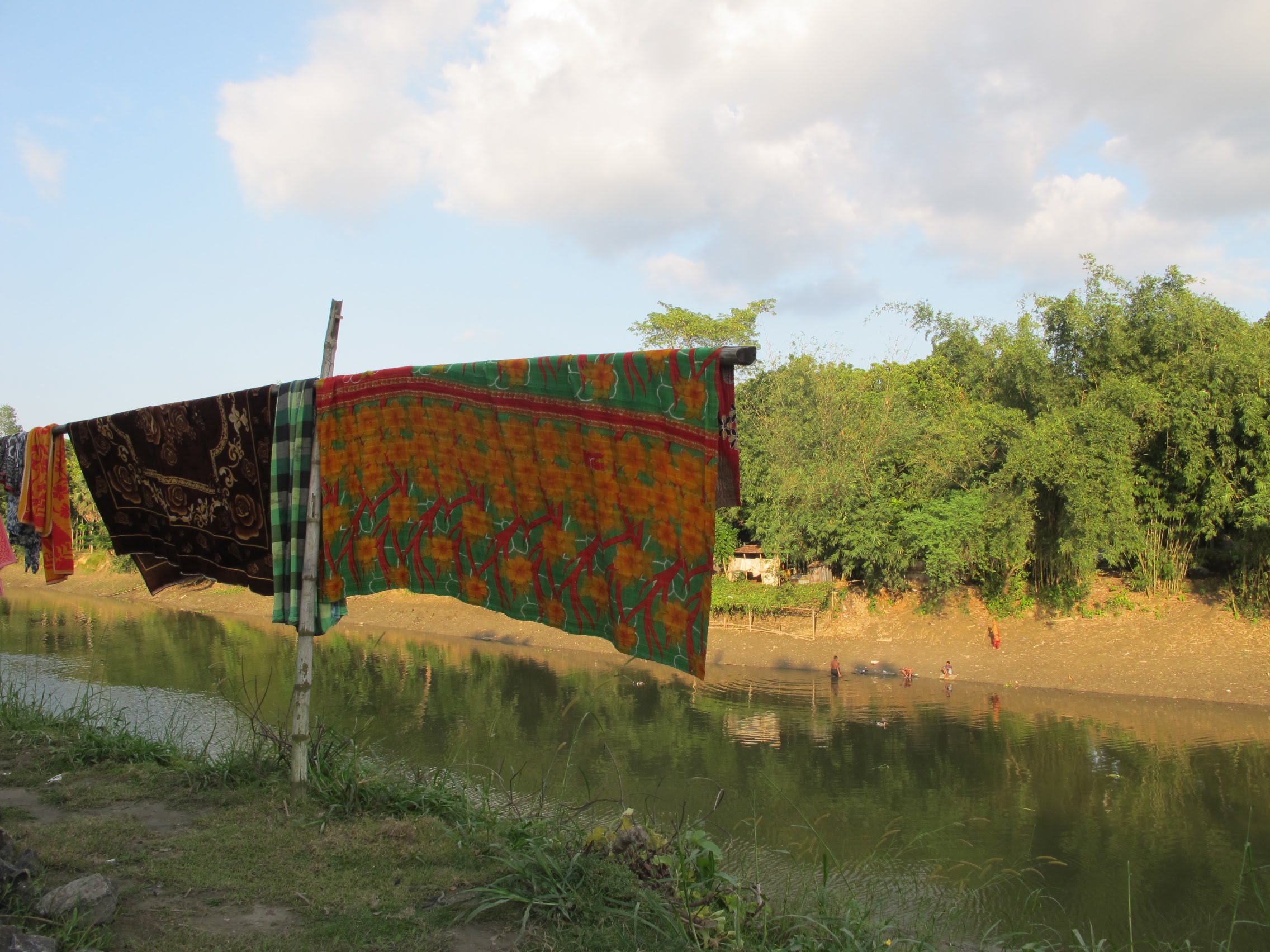 A kantha blanket hangs to dry in the Bangladesh countryside